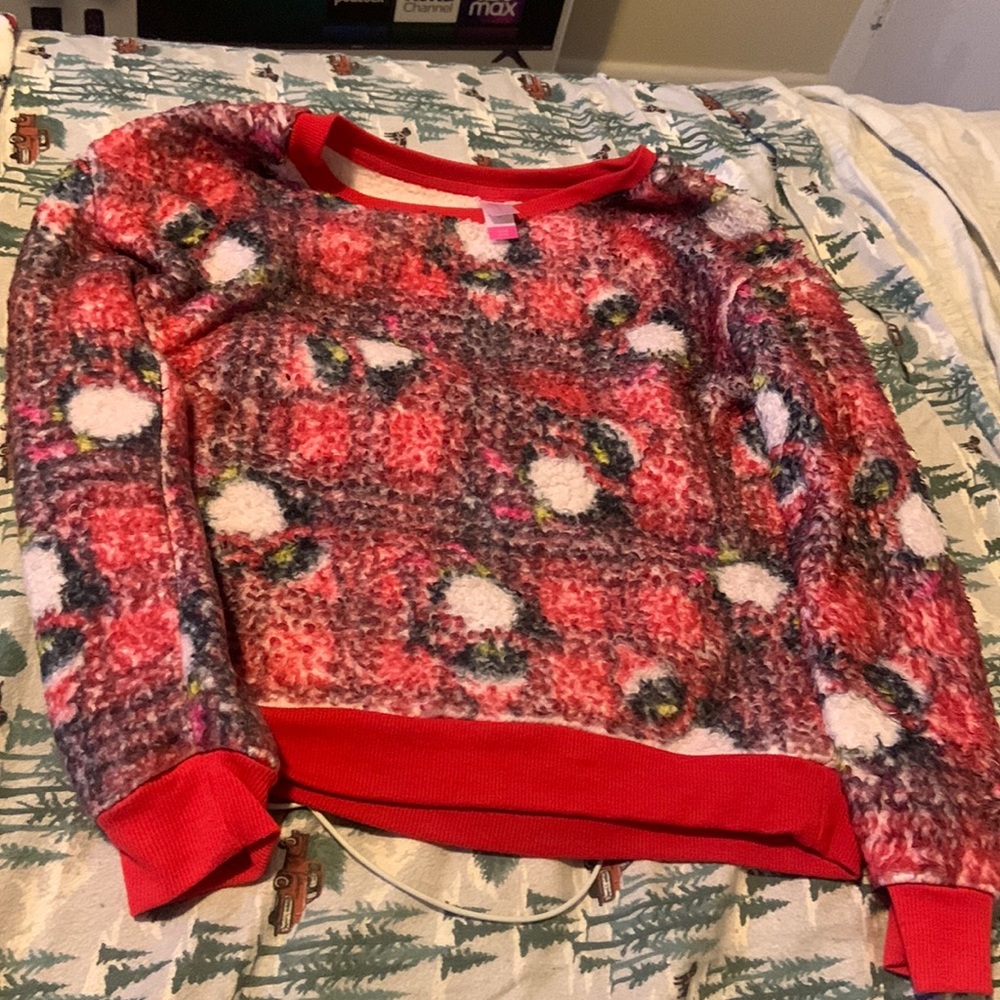 A penguin sweater that is a small size 3-5 and it is super warm.